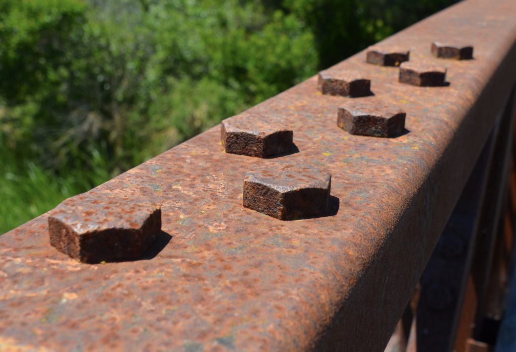 Image of rusting corten steel bridge with fasteners