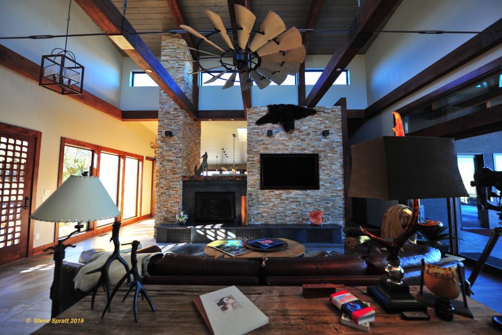 Image of high beams living room, fireplace and ceiling fan certainly will need a user guide for your home