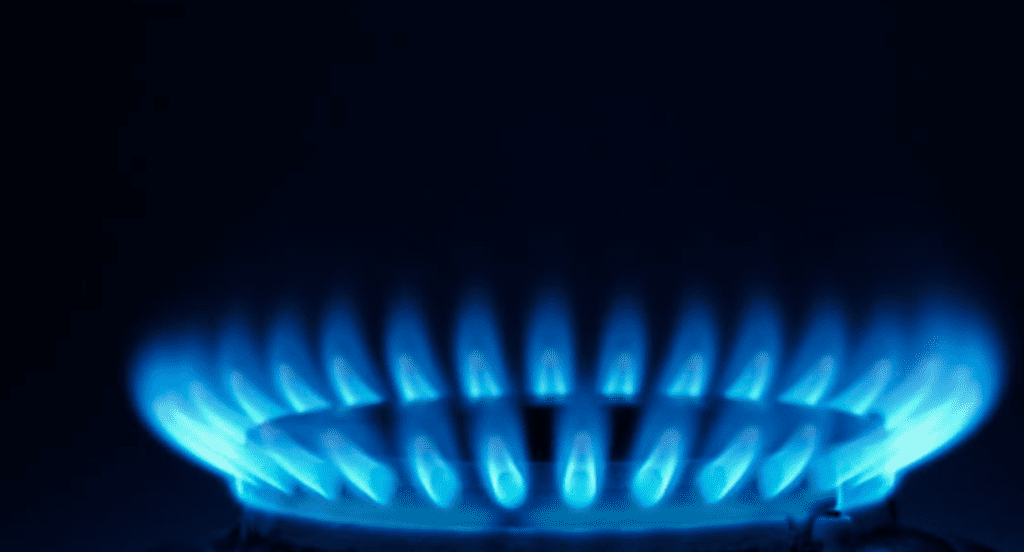 Image of natural gas cooktop burner blue flames